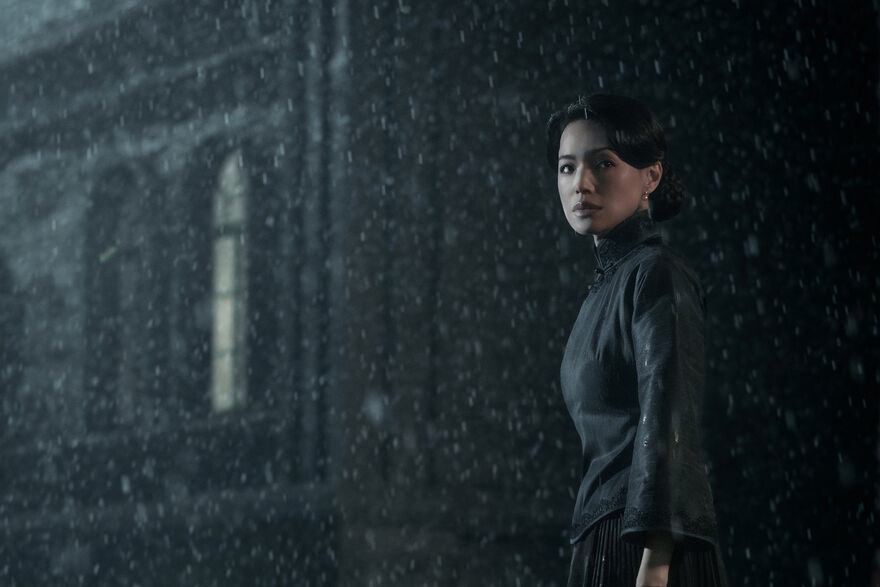 A woman stands in the rain in Chinese drama Resurrection