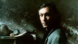 A man in a dimly lit room