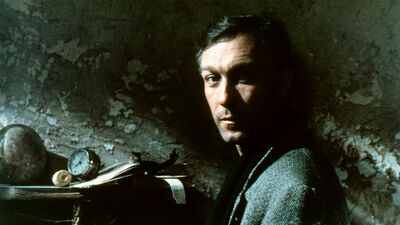 A man in a dimly lit room