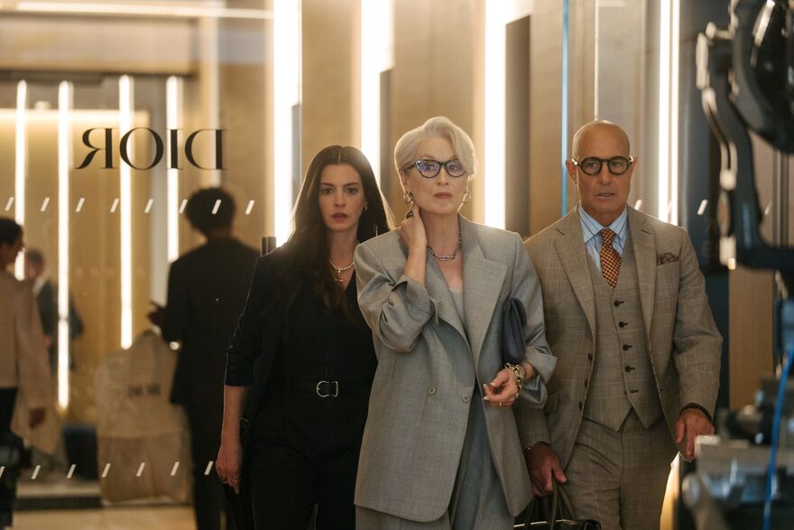 Anne Hathaway, Meryl Streep and Stanley Tucci walking out of Dior offices in The Devil Wears Prada 2
