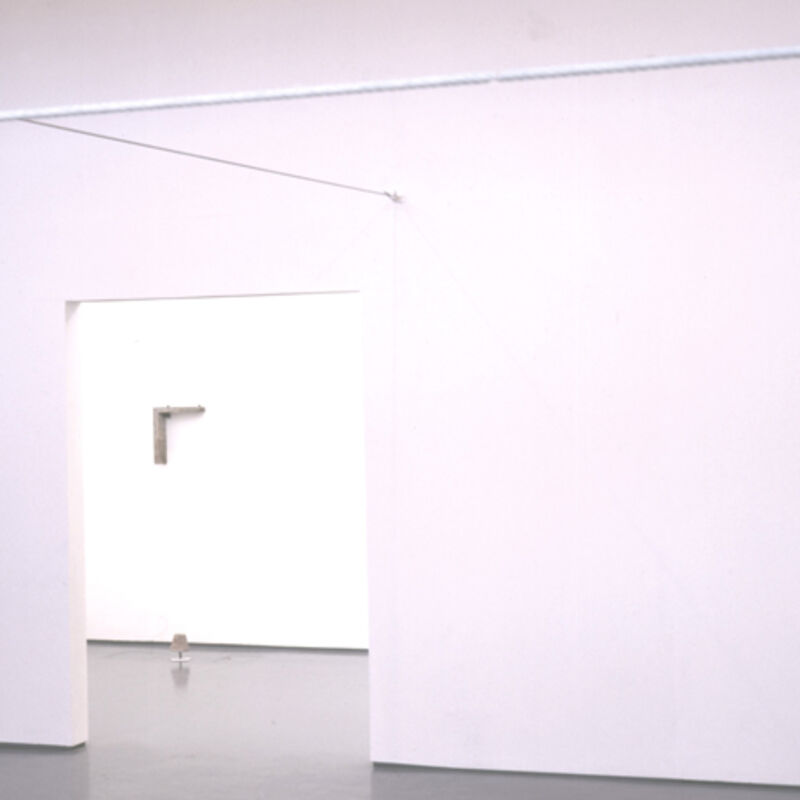 From Miroslaw Balka's exhibition at DCA. A white gallery room is shown, with a white pole protruding around it.