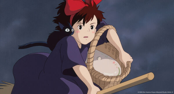 A cat and a young girl fly on a broomstick carrying a basket