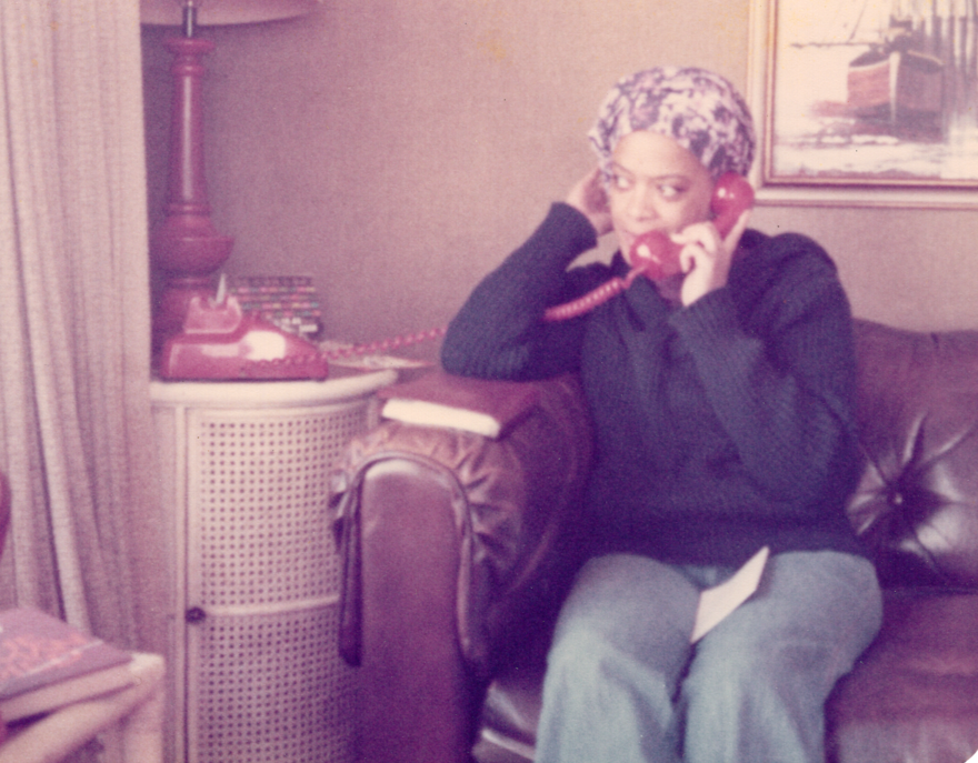 Toni Bambara in headscarf on phone