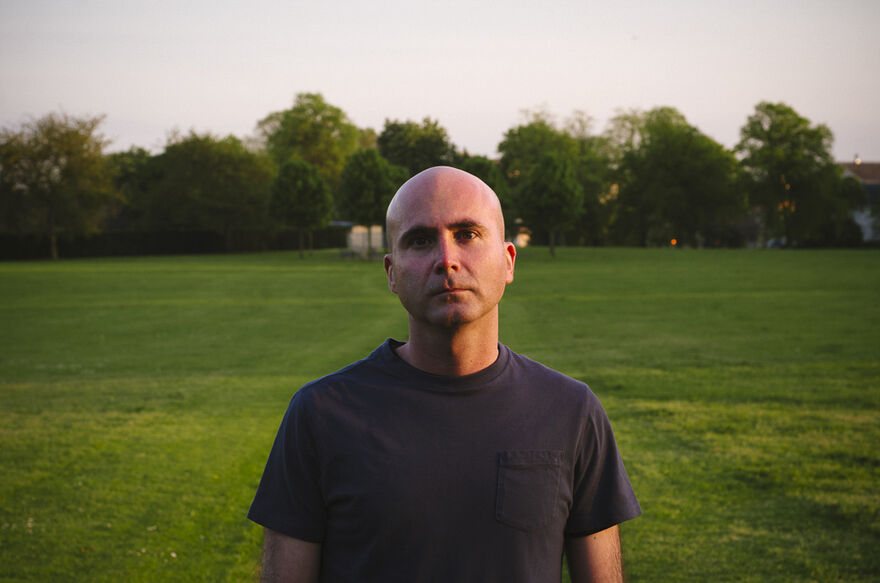 Photo of Barrie Morton standing in a park at golden hour