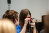 Person looking through a tiny viewfinder