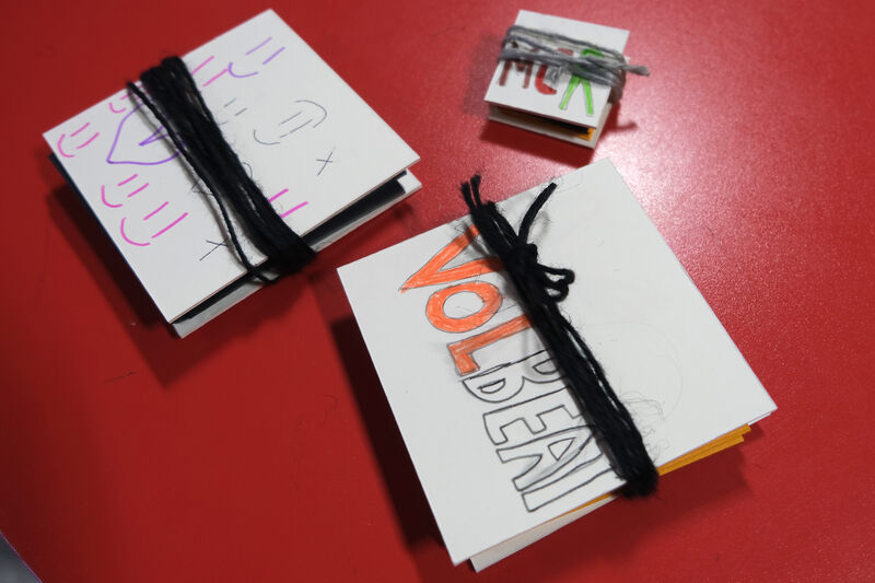 Three origami hand made books of different sizes