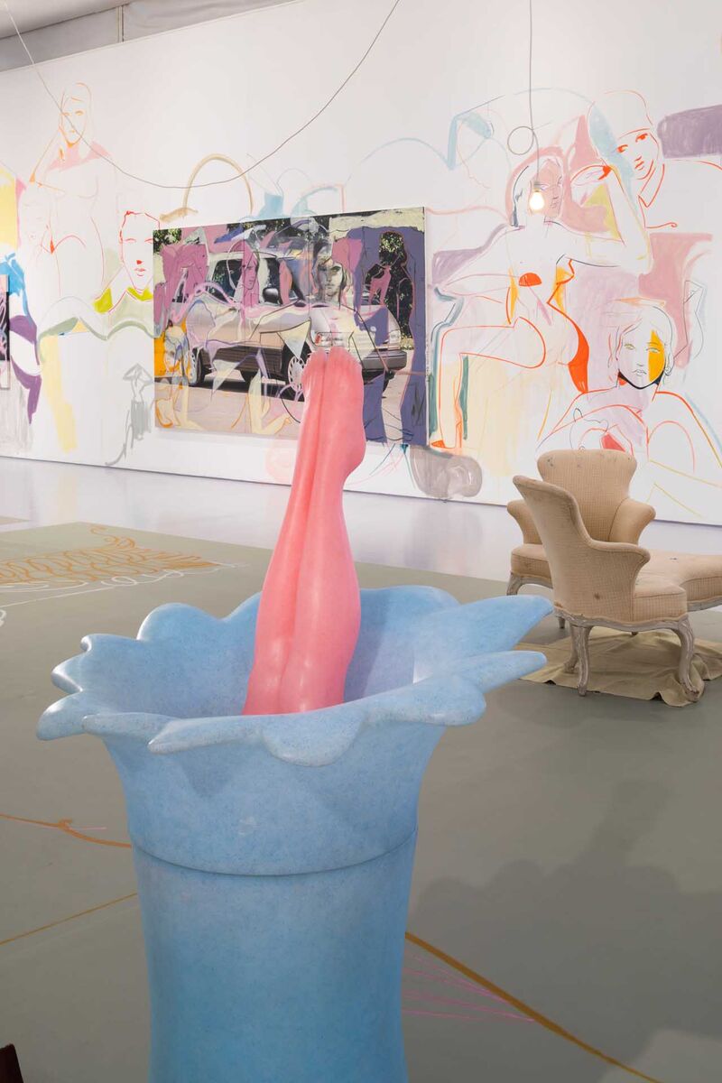 plastic dolls legs protrude from a plinth on the wall in the background figures are painted in loose brush strokes in colourful pastels