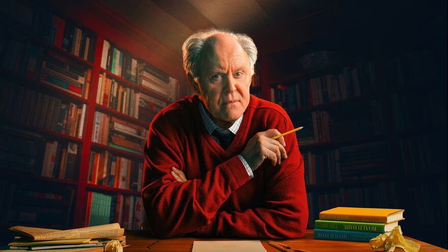 John Lithgow at a desk as Roald Dahl