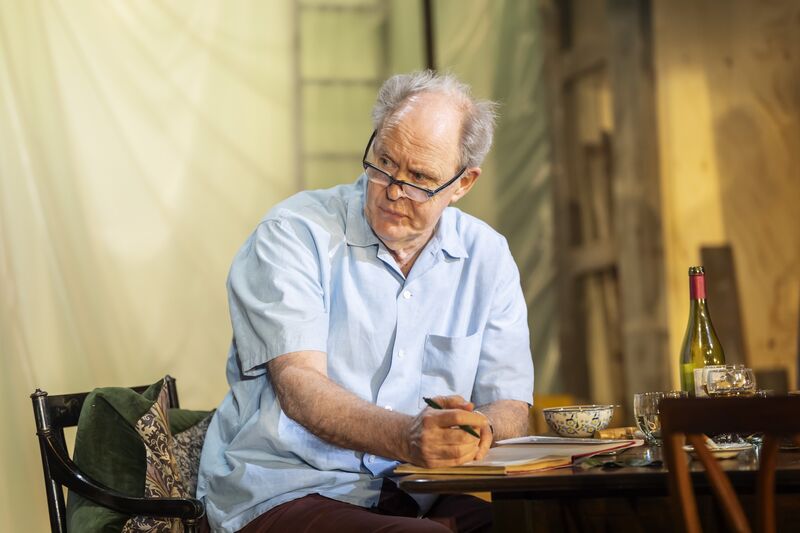 John Lithgow in reading glasses as Roald Dahl
