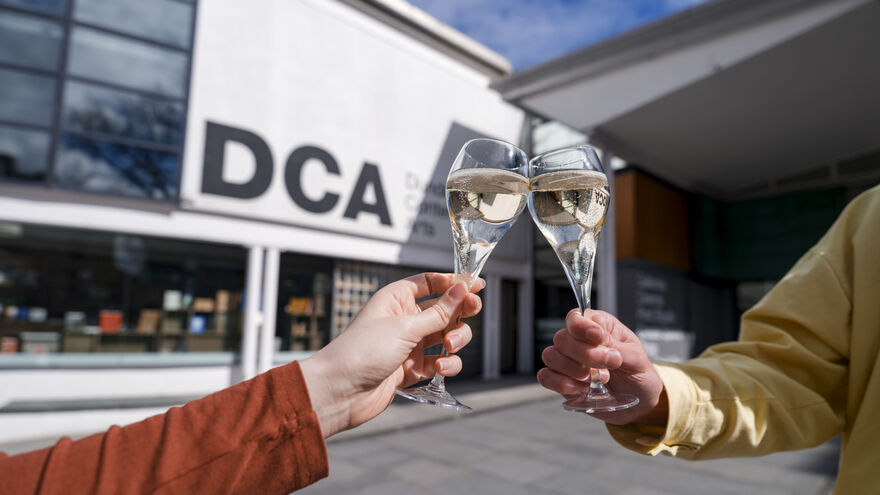 Two glasses of fizz out side DCA as if a celebration