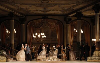 Couples dance in a ballroom in opera Arabella