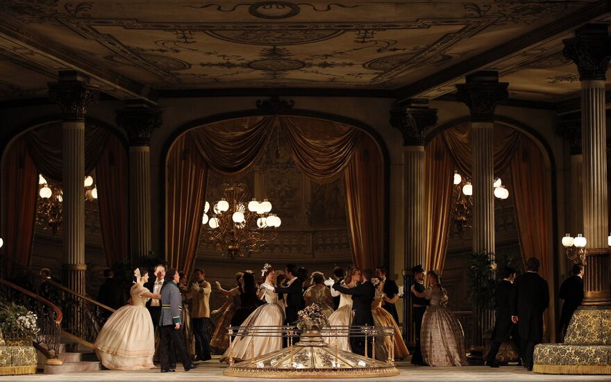 Couples dance in a ballroom in opera Arabella