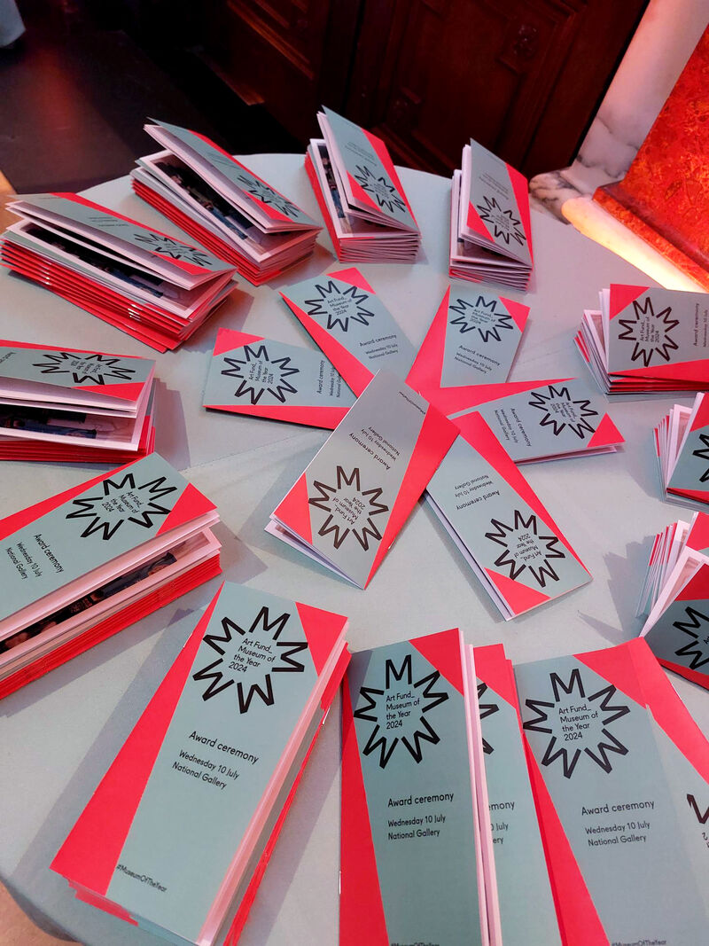 Table covered in Art Fund Museum of the Year award ceremony programme