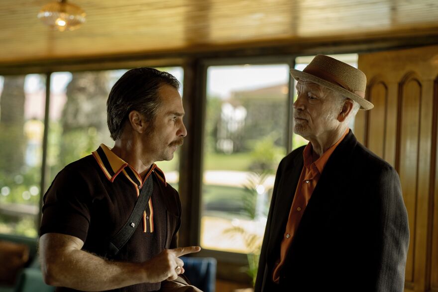 Two men look at each other