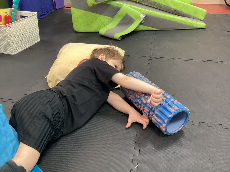 Child testing a musical roll