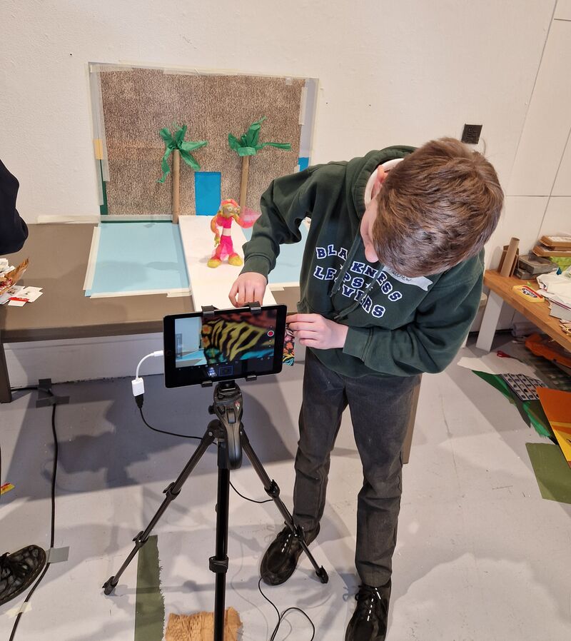 Child using an iPad to make an animation