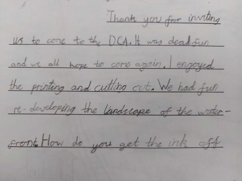 A thank you note written by a primary school pupil. Text - Thank you for inviting us to come to the DCA. It was dead fun and we all hope to come again. I enjoyed the printing and cutting. We had fun re-developing the landscape of the waterfront.