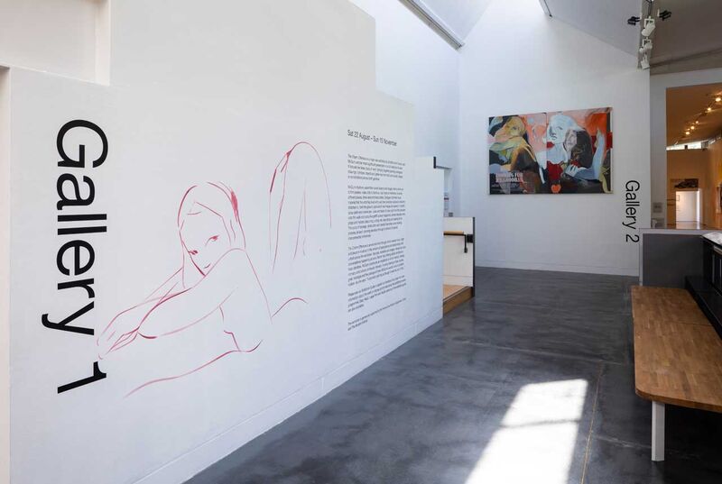 A corridor leading to a gallery entrance - the words Gallery 1 and an outline drawing visible 