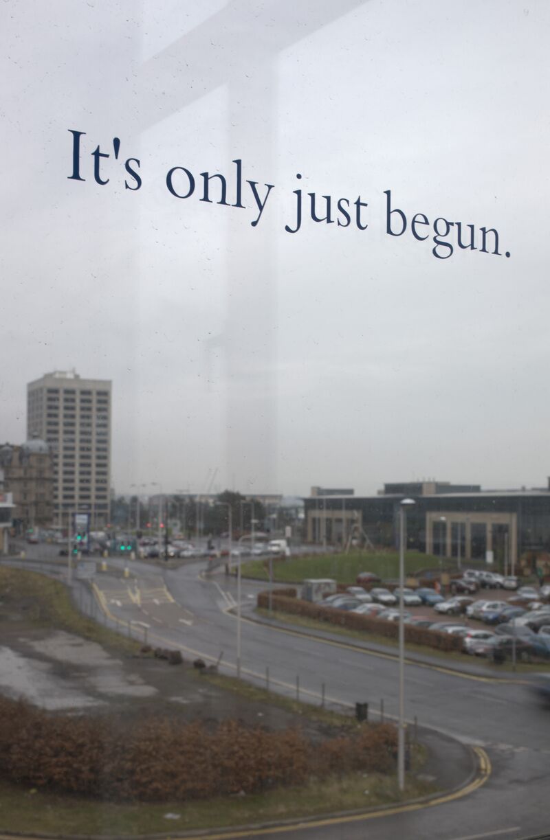 A view out of DCA window, with text that say 'It's only just begun'. For the Timecode exhibition.