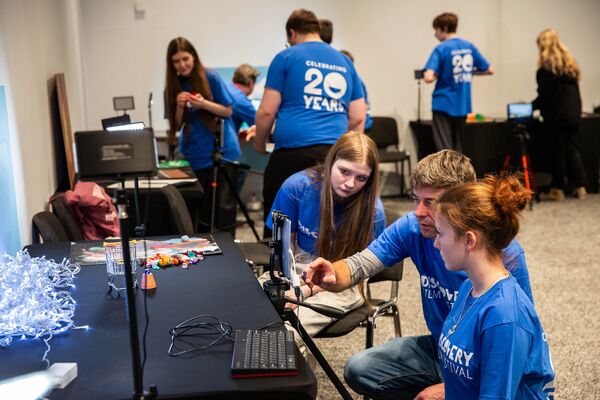 Students in blue t-shirts make stop motion animation films at DCA