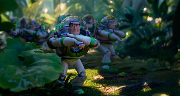Multiple astronaut toys are moving forward towards us through a leafy jungle scene. Buzz Lightyear is the astronaut toy.