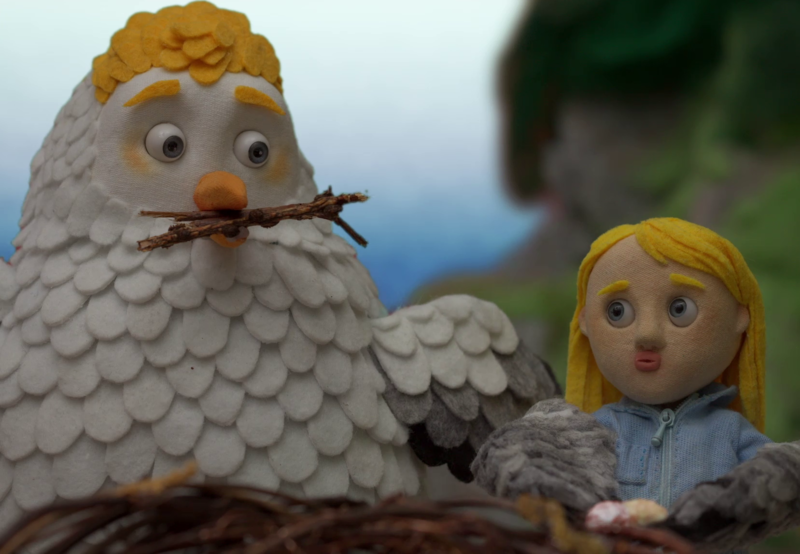 ANimation still shows a girl with a large bird building a nest.