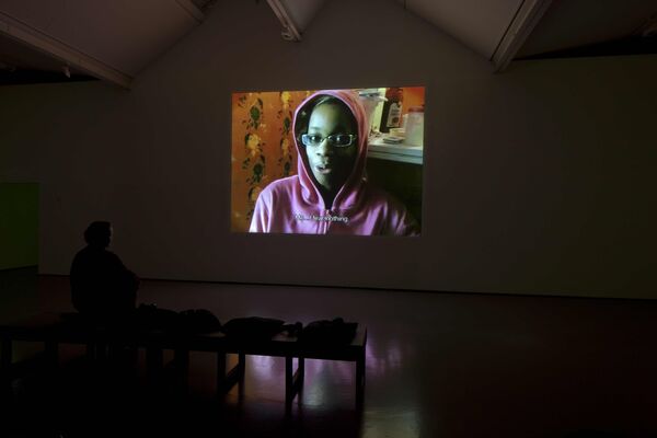 For Nikolaj Bendix Skyum Larsen's exhibition at DCA, seats face a projection. On the projection, a video plays of a child. The child says in subtitles 'Me, I fear nothing'.