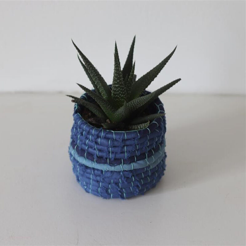 Fabric plant pot made from blue fabric scraps