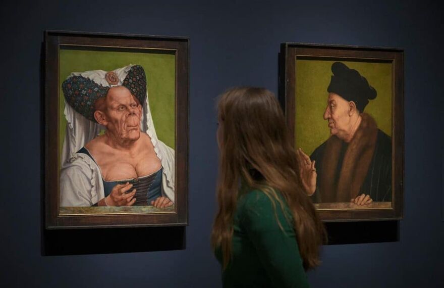 A visitor to the National Gallery looks at 'The Ugly Duchess' by Quentin Matsys,