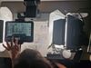Person making an animation using an iPad and hand drawn images