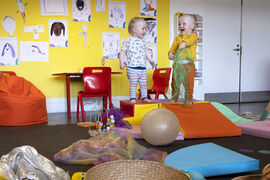 Two children surrounded by toys in DCA Create Space