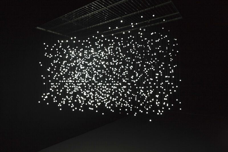 An installation from Jim Campbell's exhibition - hundreds of circular lights are suspended from the ceiling.