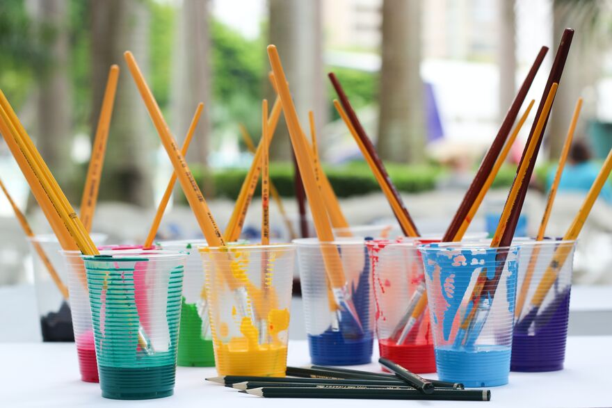 brushes in paint pots
