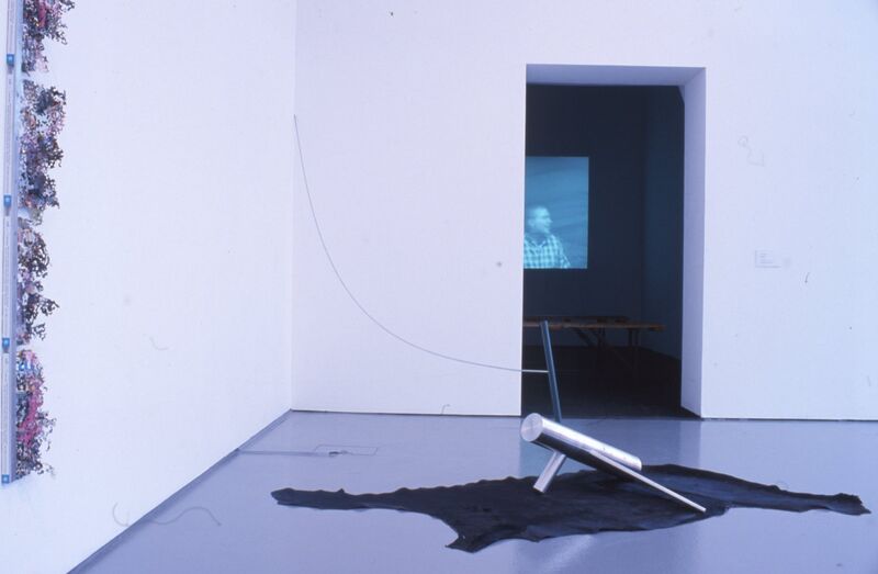 A cyndrical, metal shape rests on a black piece of fabric in DCA Galleries.