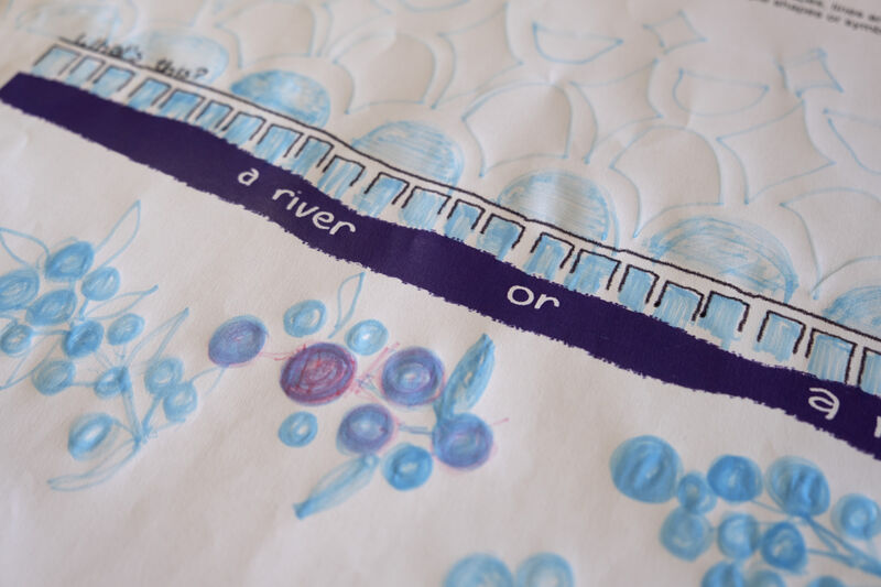 Deatil of an activity sheets with patterns drawn in blue pencil