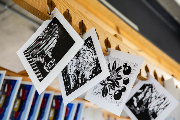 Black and white lino cuts hanging up to dry in DCA Print Studio