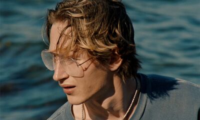A young man glasses by the sea