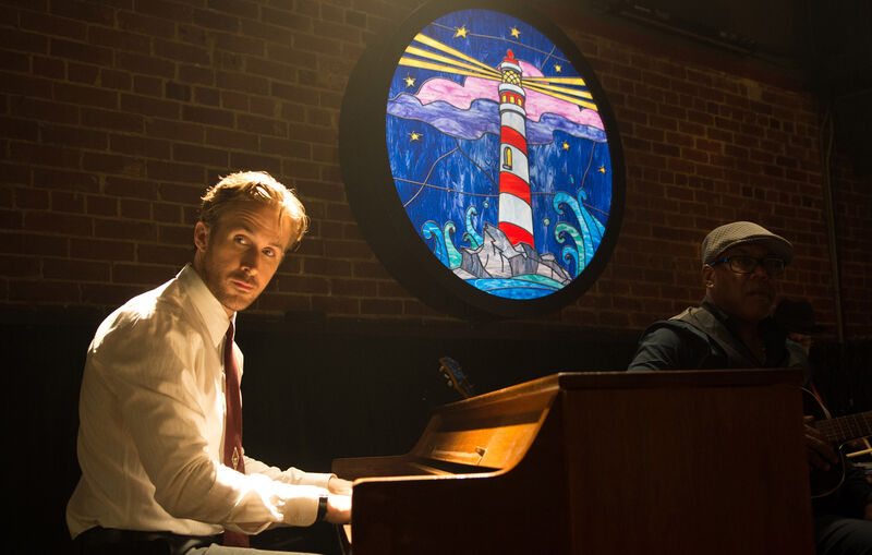 A man plays a piano in a bar