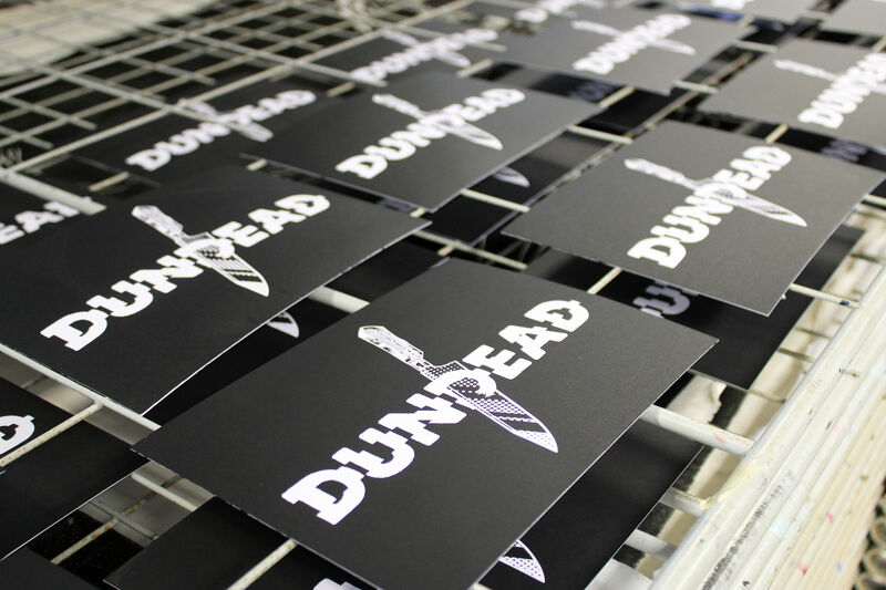 Black layer of Dundead Print drying on the rack in DCA Print Studio