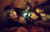 Two women in a cave