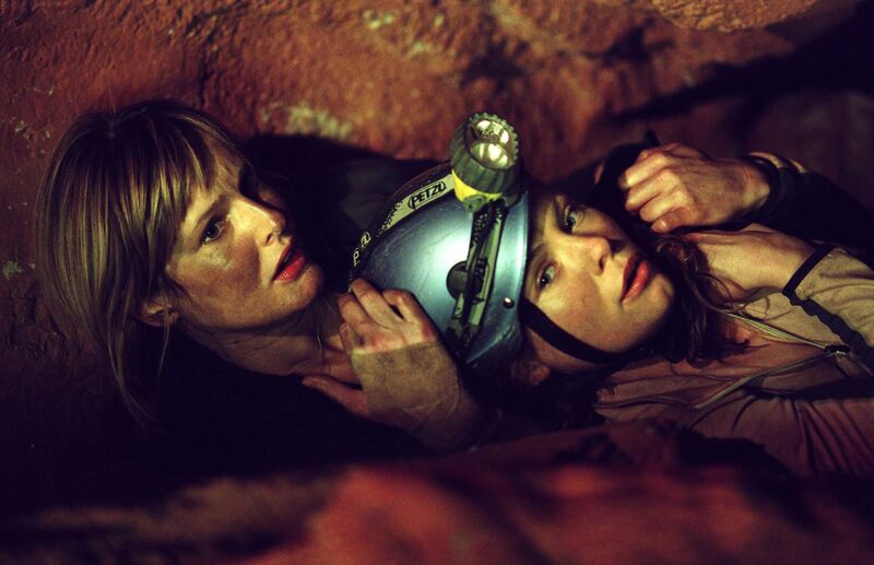 Two women in a cave