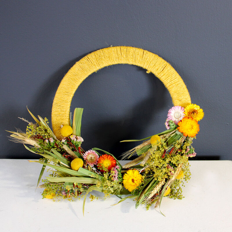 Wreath made with dried flowers and yellow twine