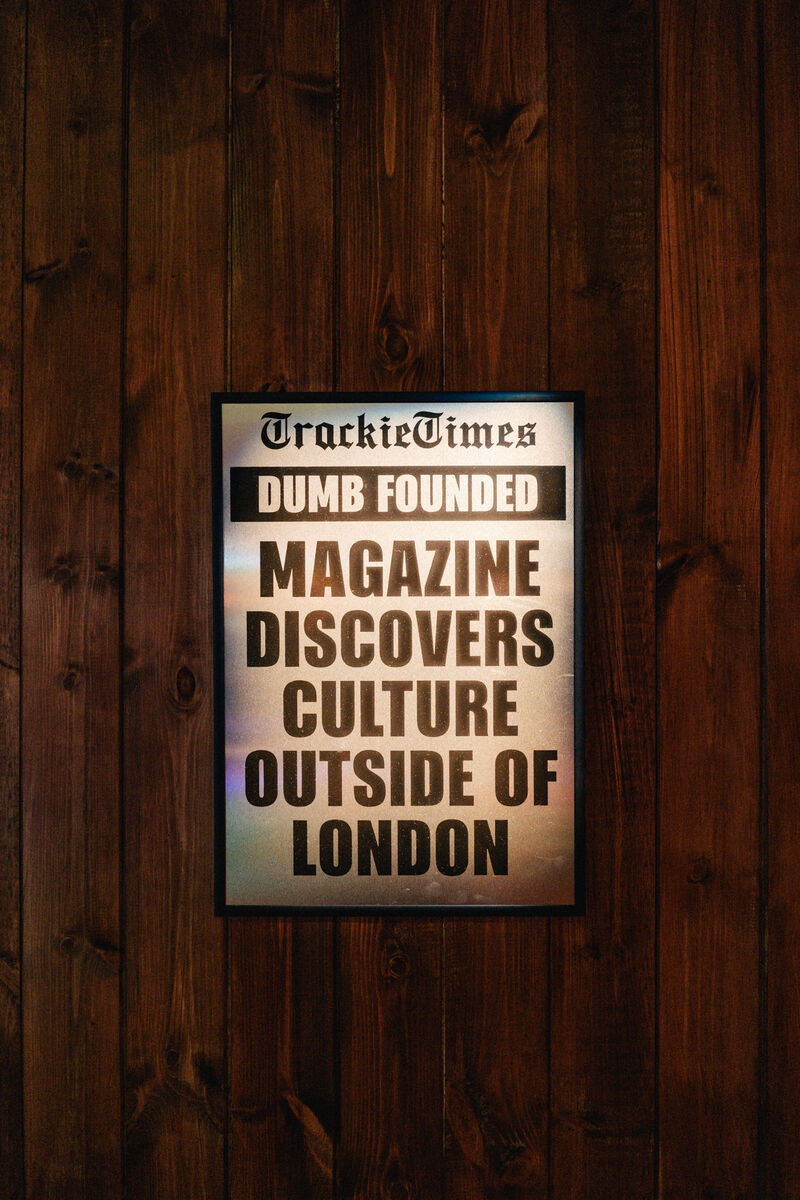 A fake newspaper headline page in a frame