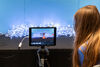 Person looking at IPad pointed towards a stop motion animation set