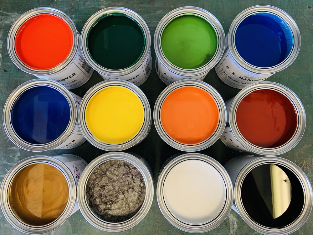 Pots of different coloured pains for signwriting