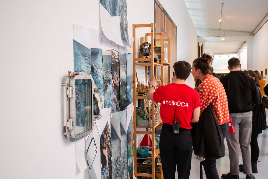 Visitor Assistant talking to visitor in DCA Gallery