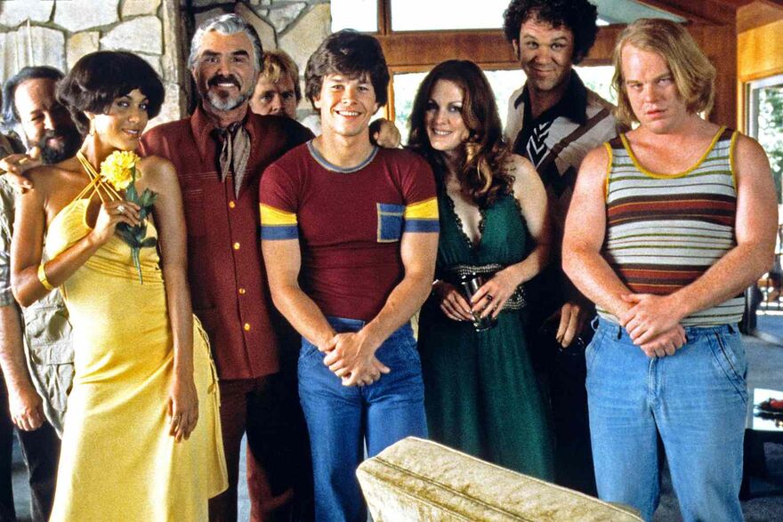 The cast of Boogie Nights in 1970s costume