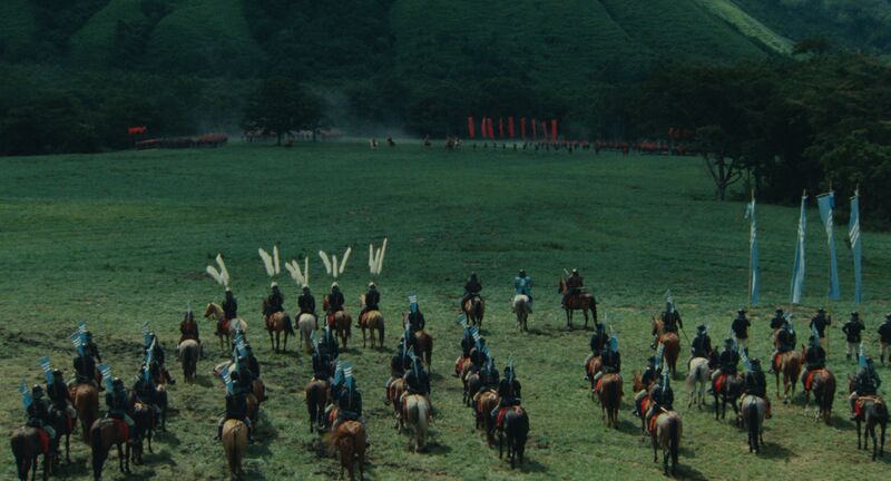 A group of samurai on horseback gather on a field.