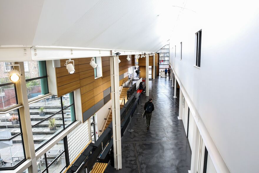 View of DCA's ground floor interior, with customers walking, sitting and browsing.