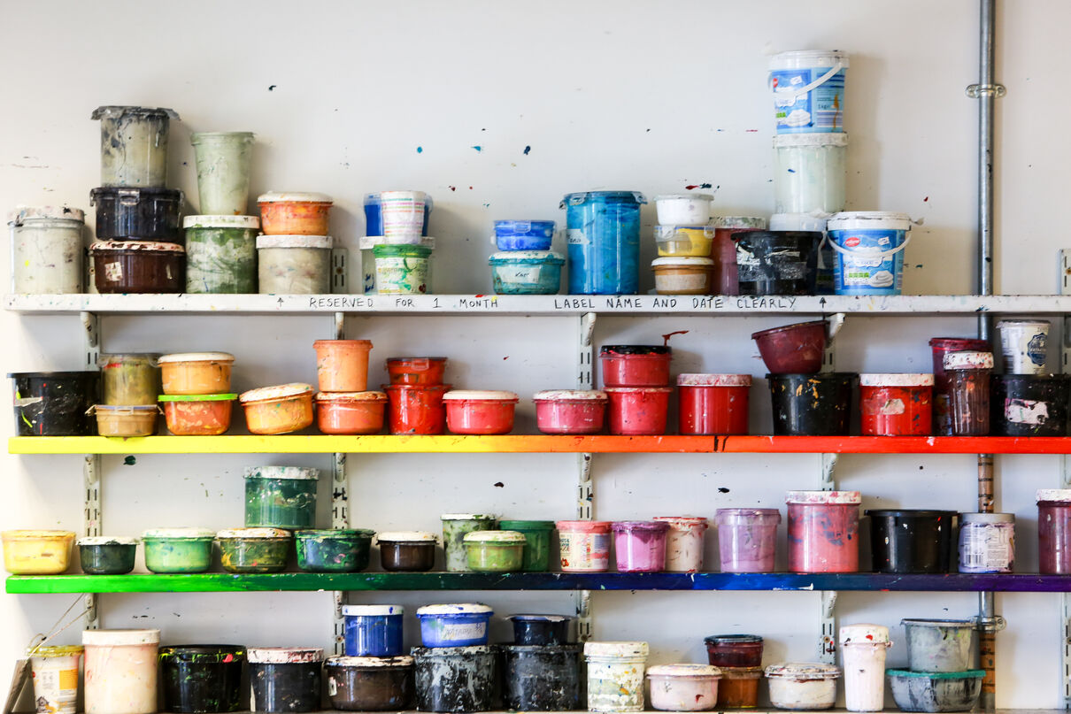 Shelves with pots of different coloured inks